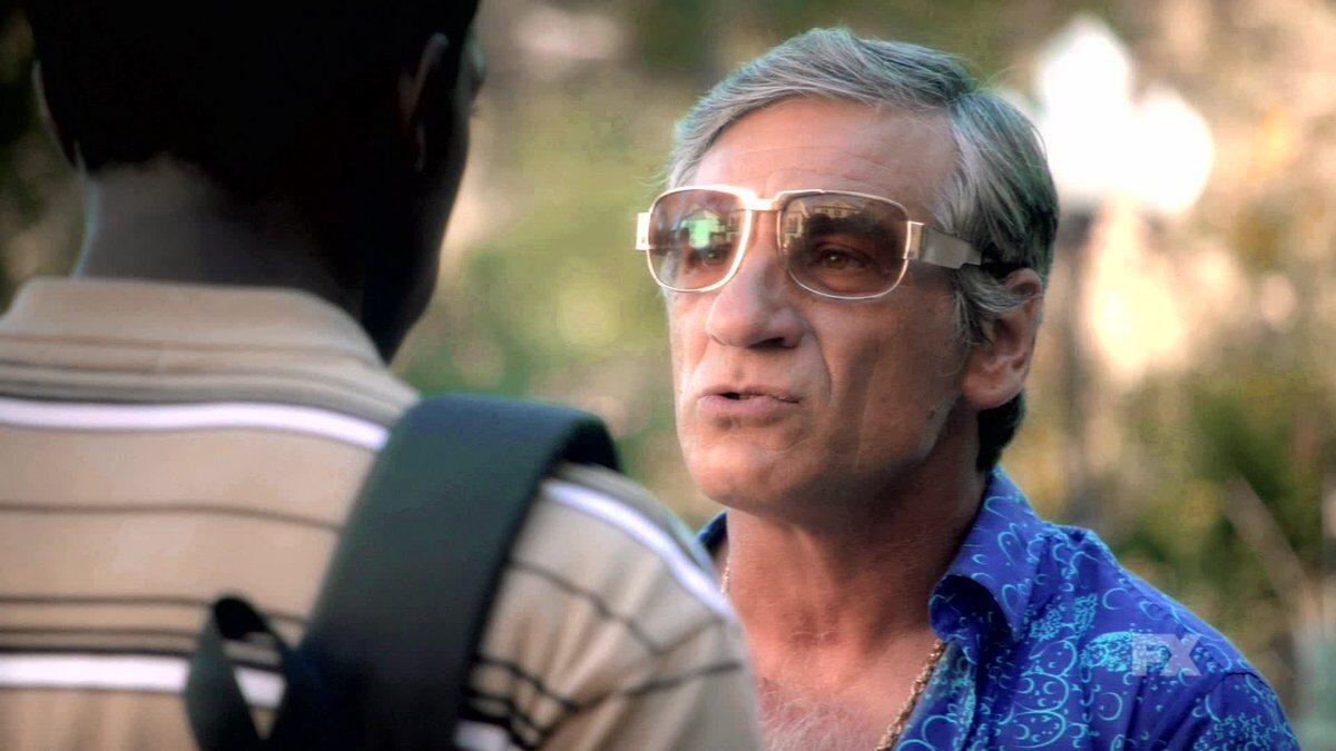 Avi Drexler mid-conversation with Franklin, sunglasses on, reading him more than answering him.